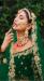 Picture of Fascinating Net Dark Green Lehenga Choli