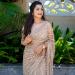 Picture of Enticing Net Rosy Brown Saree